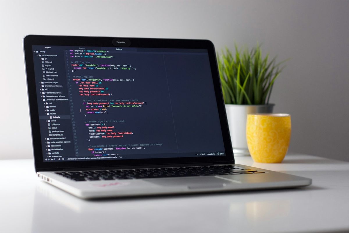 Source code on a dark editor in warm tones — engineered logic